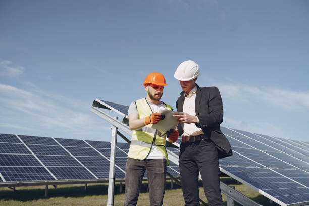 istock Foreman and businessman at solar energy station 1262562021