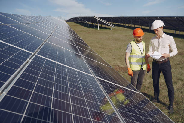 istock Foreman and businessman at solar energy station 1262563115