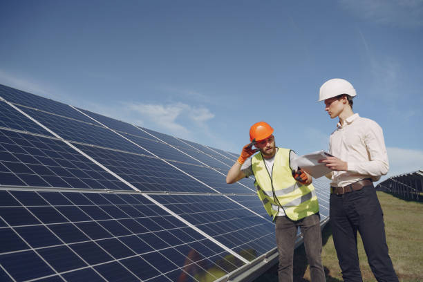 istock Foreman and businessman at solar energy station 1262563131