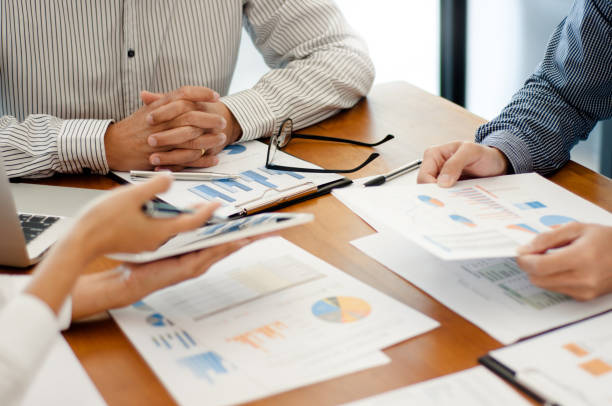 istock Team work discussing in valuation data in meeting room. 1262564096