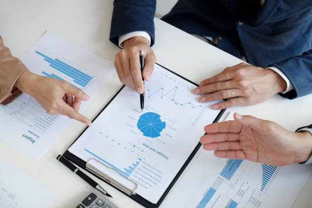 istock Financial inspector calculating a numbers in office room. 1262564169