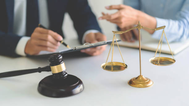 istock lawyer consulting with client discussing about contract. 1262564183