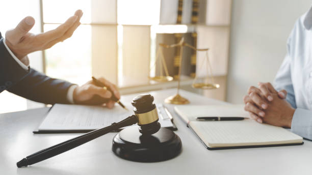 istock lawyer consulting with client discussing about contract. 1262564184