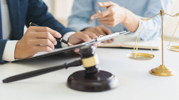 istock lawyer consulting with client discussing about contract. 1262564185