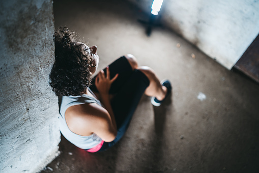 Depressed helpless woman sitting alone