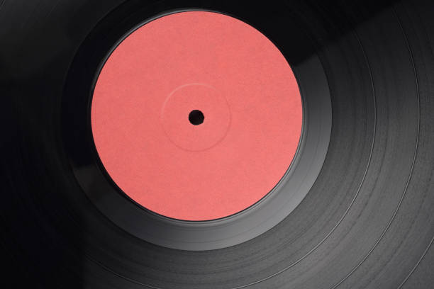 12-inch LP vinyl record with blank red label. Close-up shot, top view