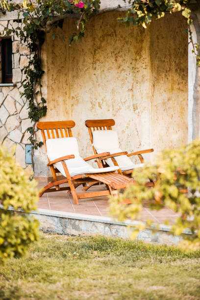 istock Cozy Scene with Two Sunbeds in Garden. 1262570517