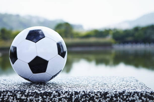 Soccer ball by the lake