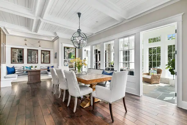 Photo of Elegant yet informal dining area of new home with coffered ceiling