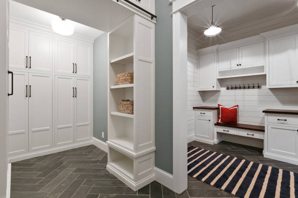 istock New and spacious mud room with chevron tile flooring and white cabinets 1262572396