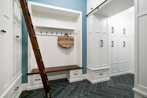 istock New and spacious mud room with chevron tile flooring and white cabinets 1262572399