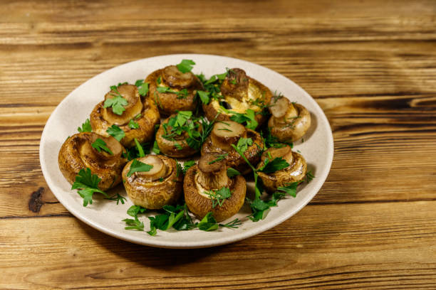 istock Baked mushrooms in plate on wooden table 1262572616