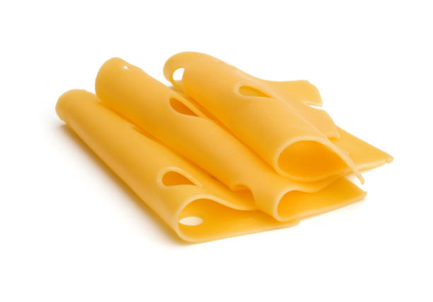 istock cheese slices isolated on white background cutout 1262575130