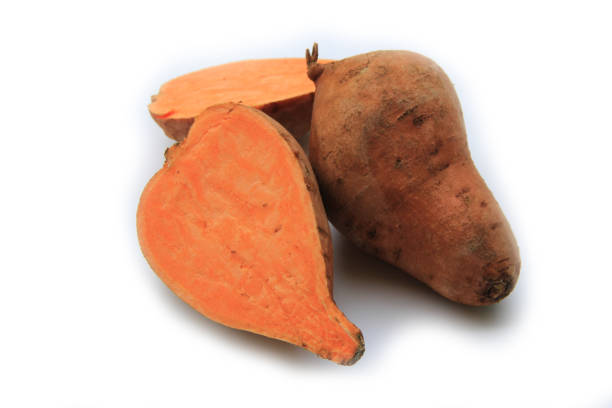 istock Ripe red two sweet potatoes with slices on white 1262575210