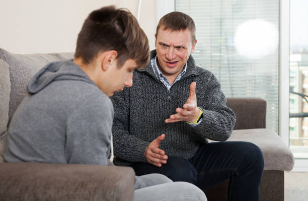 istock Angry father screaming at offender son 1262576446