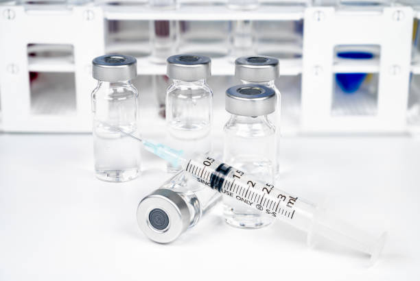 istock Vaccine concept with syringe and ampoule on white background. 1262577763