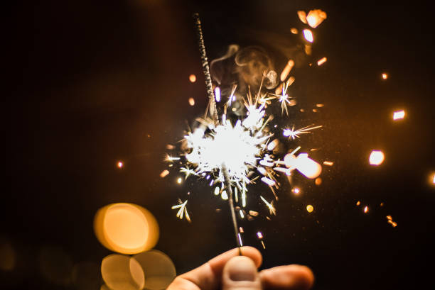 istock Burning sparkler in hand close-up 1262577816