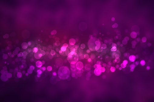 Abstract gradient of dark violet pink magenta background texture with glowing circular bokeh lights and stars. Beautiful purple backdrop.
