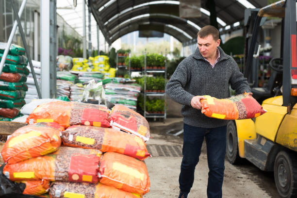 istock Active man working in warehouse at garden store 1262582196