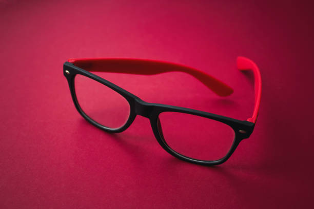 istock Graduated glasses on red background. Close-up. Eyecare concept. 1262584750