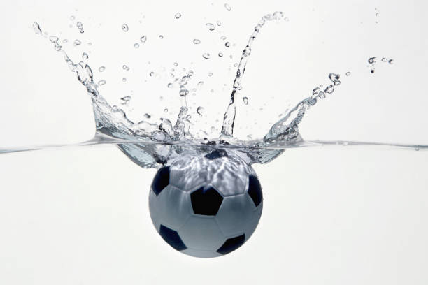 istock Soccer ball splashing into water 1262585243