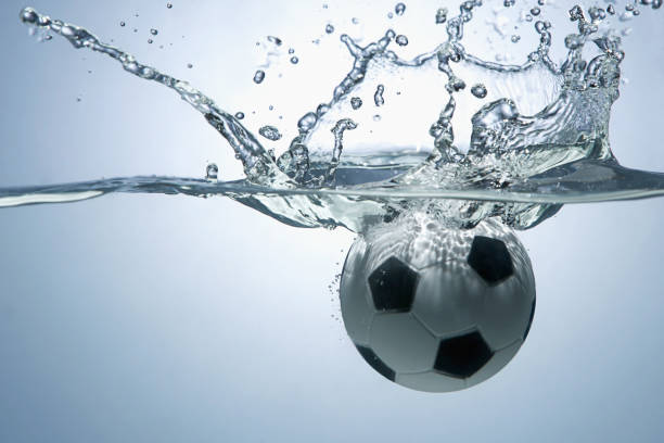 istock Soccer ball splashing into water 1262585512