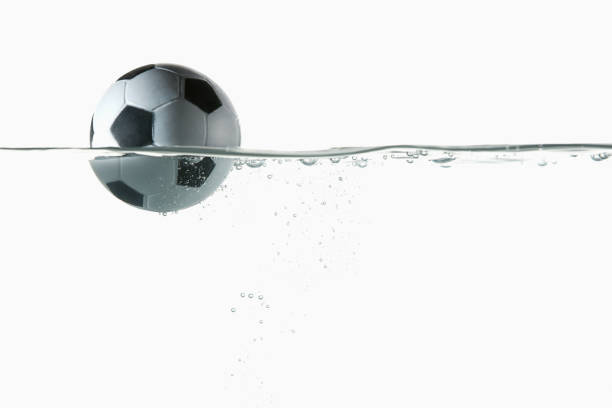 istock Soccer ball splashing into water 1262585548