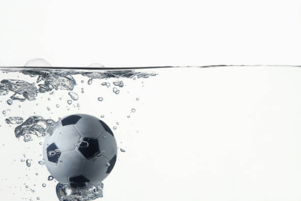 istock Soccer ball splashing into water 1262585697