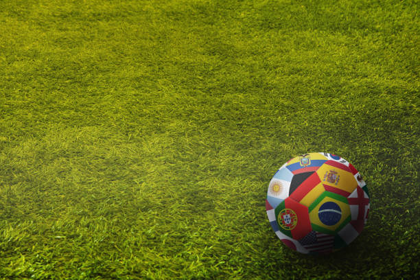 istock World flags soccer ball on a playing field 1262587104