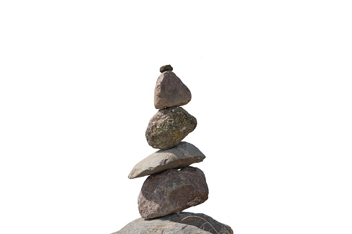 Stacked stones as a stone tower over white background