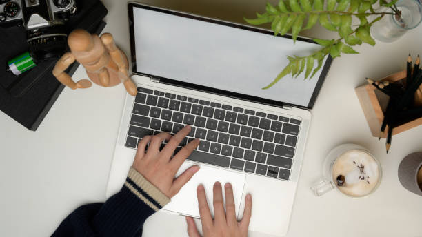 istock Female working on laptop with clipping path on office desk 1262592611