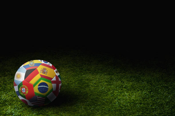 мир флаги футбольный мяч на игровом поле - portugal ghana стоковые фото и изображения