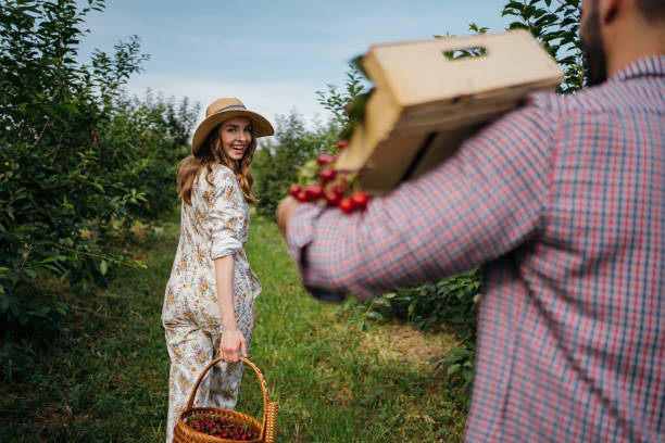 istock Beautiful couple in the orchard 1262593603