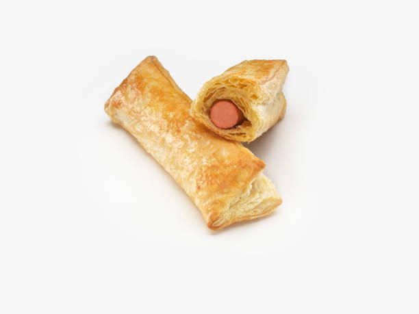istock Isolated puff pastry with sausage on a white background. 1262595656