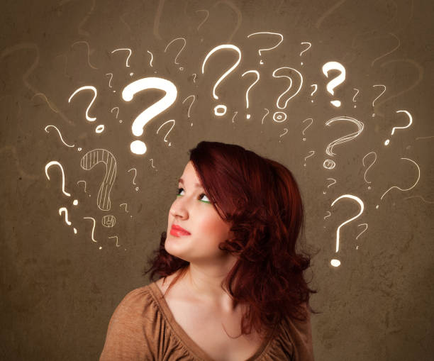 istock girl with question mark symbols around her head 1262597120