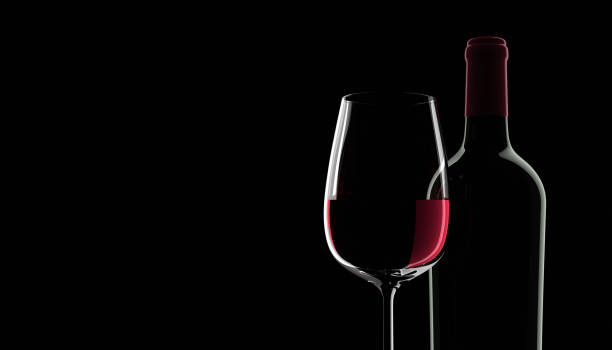 Blank bottle of red wine with glasses Blank bottle of red wine and glass with dark background winemaking photos stock pictures, royalty-free photos & images