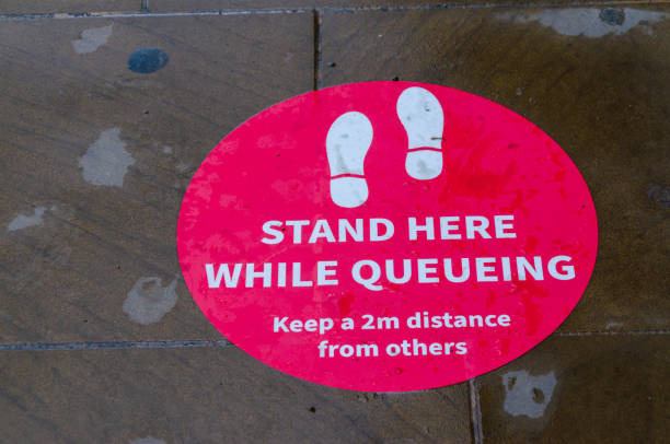 istock A pavement sticker reminds pedestrians to keep 2m apart 1262599492