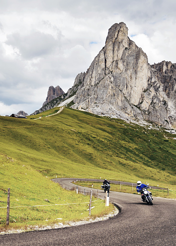 Bikers Riding on Mountain Road, Dolomites, European Alps.