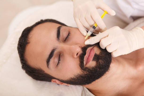 istock Man getting face filler injections 1262600560