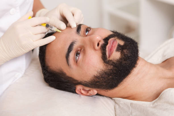 istock Man getting face filler injections 1262600567