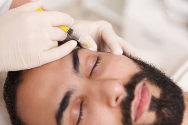 istock Man getting face filler injections 1262600595
