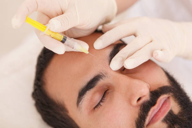 istock Man getting face filler injections 1262600615