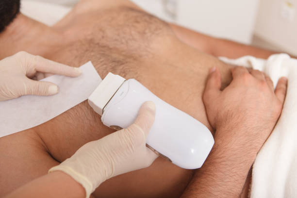 istock Man getting waxing hair removal at the salon 1262600708