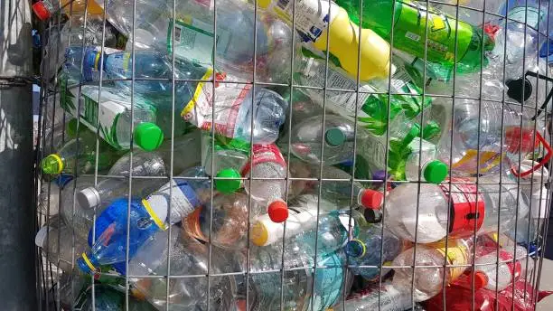 Different colored plastic bottles in bin