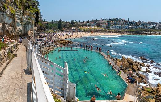 Sydney, Australia - December 28th, 2019: Walking to Waverley Cemetery along the Bondi to Coogee coastal walk. A cliff top coastal walk featuring stunning views, beaches, cliffs, and rock pools.