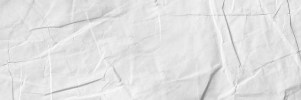 istock background with scattered overlay of crumpled papers. 1262603256