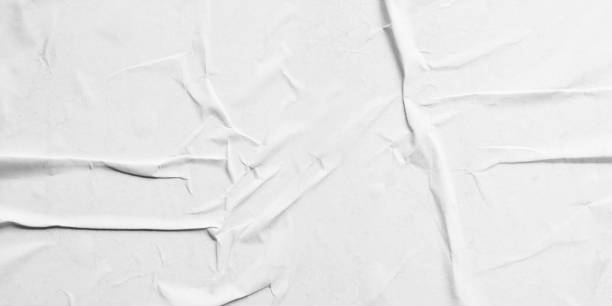 istock background with scattered overlay of crumpled papers. 1262603476
