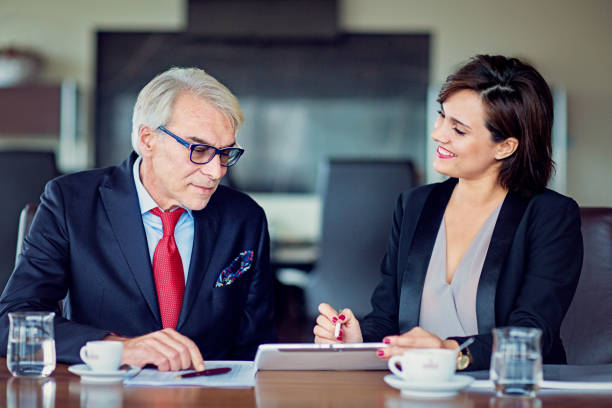 istock Manager is discussing with coworker in an office 1262604213