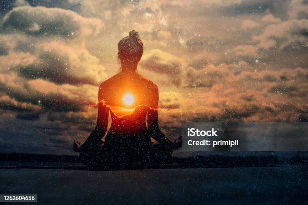 Yoga Day Concept Multiple Exposure Image Clouds And Sun Pranayama In Lotus Asana Stock Photo - Download Image Now