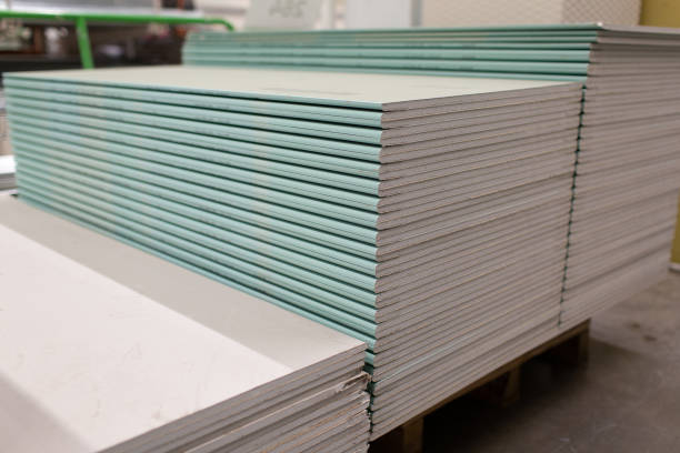 istock Pallet with Drywall sheets plasterboard in the building warehouse store. 1262605419